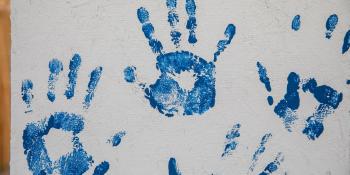 Blue handprints from a Women Build event in Fort Worth, TX.