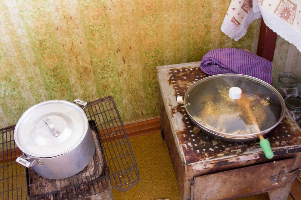 Nora prepared meals for her family on a wood stove in the middle of one of the two rooms.&amp;nbsp;