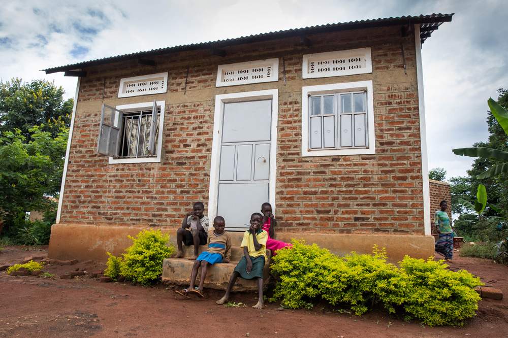 Job’s brothers and sisters in front of their new home.