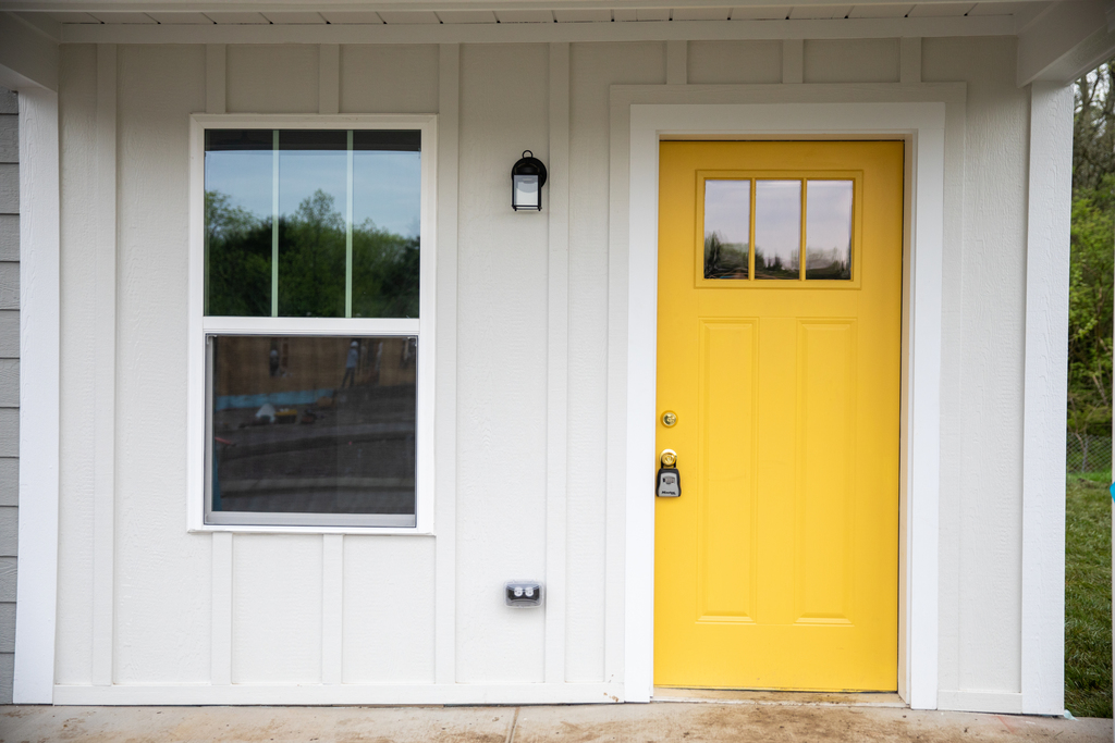A house with a yellow door.