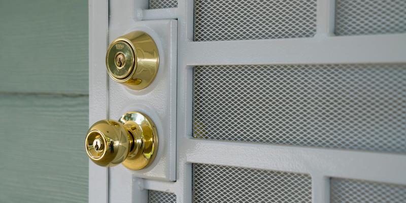 A close-up on a golden door knob.
