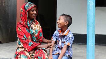 Samala and her son Aminul at the porch of their house in Jamalpur district, Bangladesh