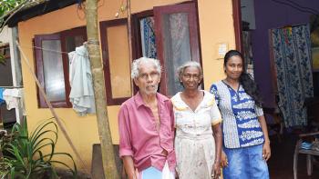 Shashika (far right) with her grandparents Arthur and Silard in front of their home in Moratuwa, Sri Lanka