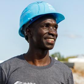 A headshot of Ronald with a blue hardhat.