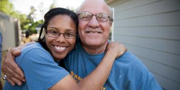 Homeowner Youkhanna and a volunteer at the AmeriCorps Build-a-thon.