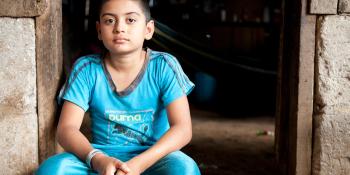 Boy sitting in doorway, Nicaragua