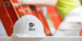 hard hat in front of a ladder