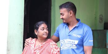 Lalita and her son Biddut outside their home in Mymensingh, Bangladesh