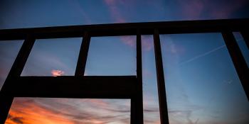 Silhouette of a wall being built.