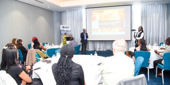Room photo of people in a meeting
