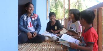 Phala, Chariya and their four children on their porch.