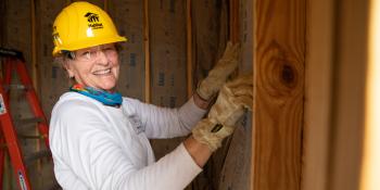 A volunteer working on the build site.