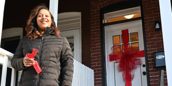 Homeowner standing by front door.