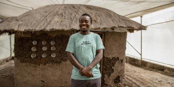 man in front of his shelter