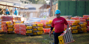 Man carrying a ladder.