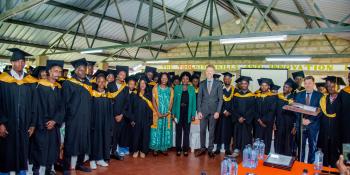 students in their graduation gowns at the ceremony