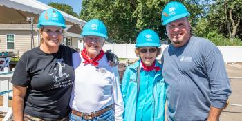 Garth and Trisha pose with Jimmy and Rosalynn Carter at the 2019 Carter Work Project