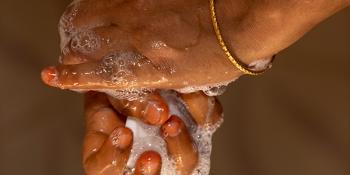 closeup of Bangladeshi woman washing her hands 