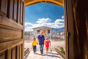 Milady Almendares Orellana, who teaches primary school, lives with her children, 6-year-old Maidy (red dress) and 4-year-old Ronal (yellow shirt), in their Habitat home.