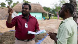 Two men discussing roofing project