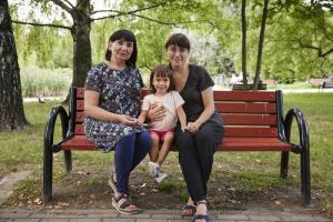 Ukrainian women sitting in the park in Warsaw