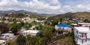 Landscape photograph of Puerto Rico neighborhood with mountains in distance