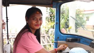 Pramila in her husband's auto rickshaw that she learned to drive
