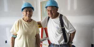 Two elderly volunteers at a Habitat build.