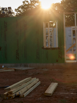 Morning sunlight over a build site.