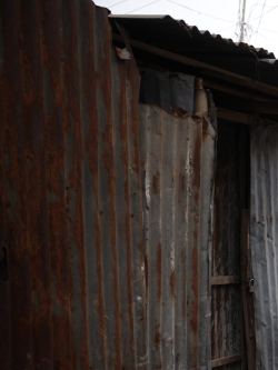 wall and roof made of pieces of rusted steel