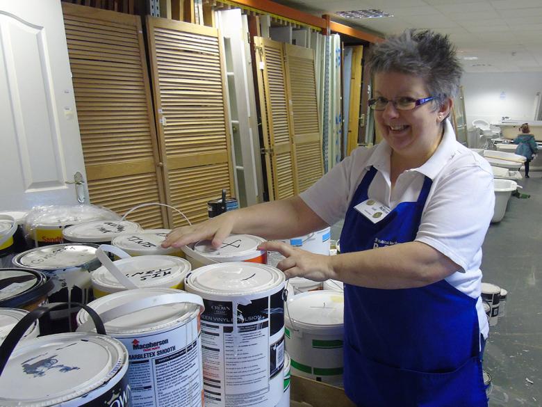 Judi sorts donated items at the ReStore.