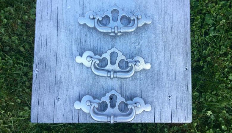 Painted dresser hardware in metallic silver