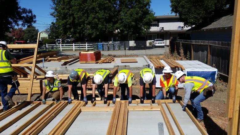 ISEC employees on build site.