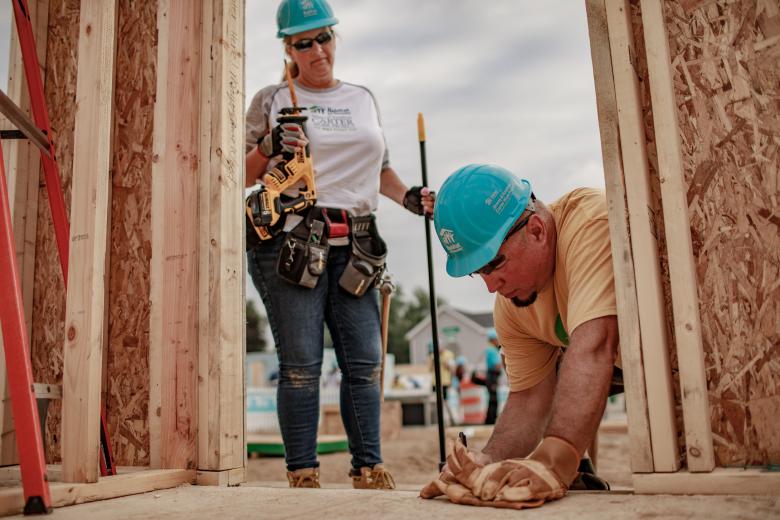 Trisha Yearwood and Garth Brooks on contruction site