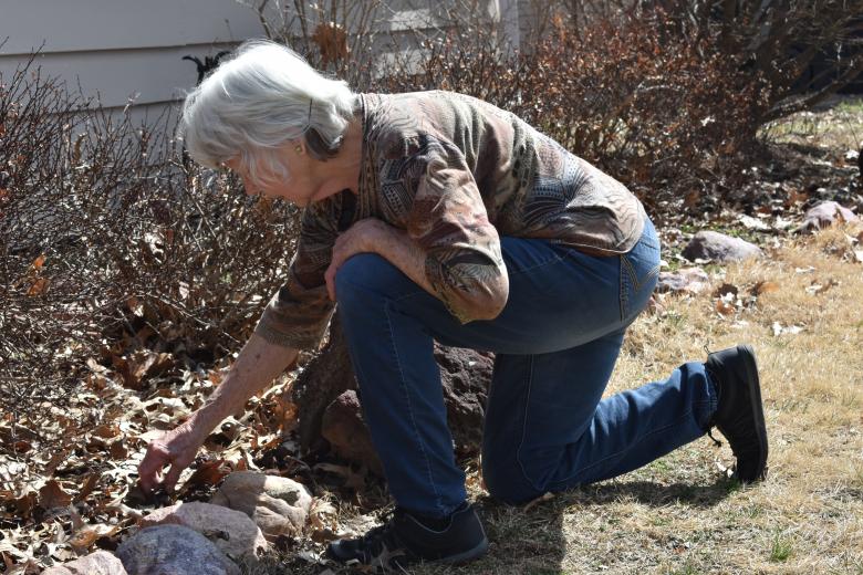 Carol outside her home.