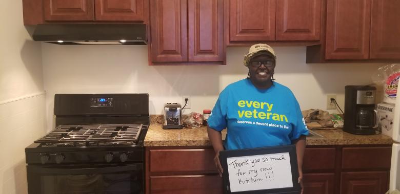 Pat standing in her kitchen.