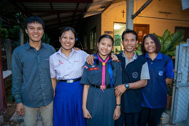 Chankam (second from right) with his wife Khamnoi (far right) and their children.