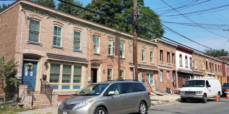 Block of townhomes rebuilt with brick and porches looking brand new.