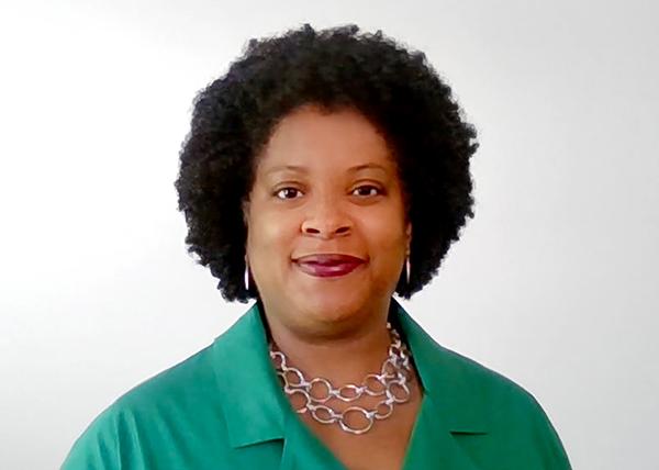 Headshot of Jacqueline Innocent in a green top.