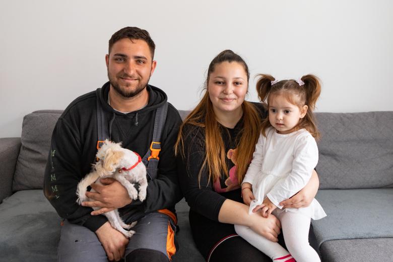 family sitting smiling