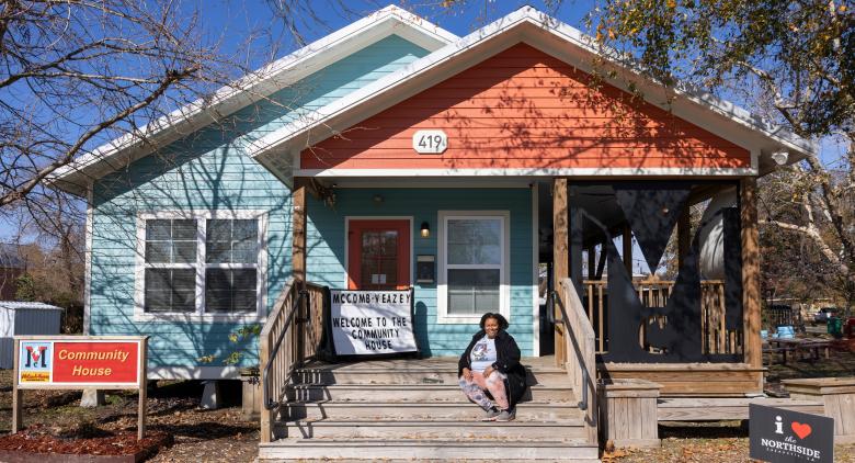 Tina Shelvin Bingham, executive director of the McComb-Veazey Neighborhood Coterie, smiles outside of the McComb-Veazey Neighborhood Community House in Lafayette, Louisiana.