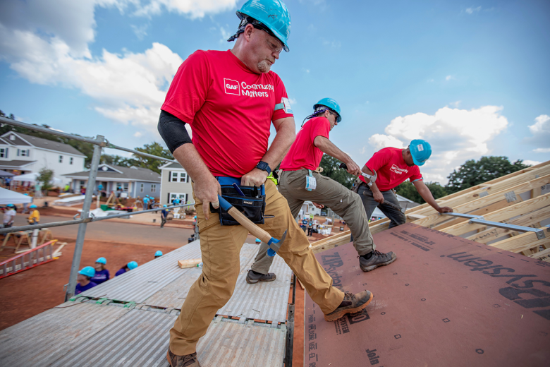 GAF volunteers working on roof.